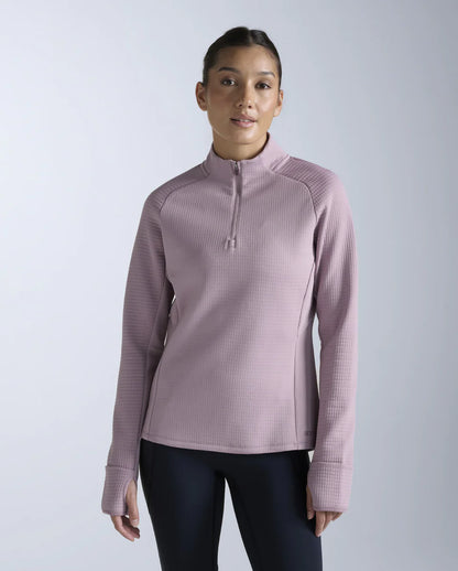 1. 1/4 zip long sleeve
2. Stand collar for neck coverage
3. 315gsm textured puff grid encapsulates air for optimal warmth while reducing microfiber shedding
4. Zip for versatile air flow management
5. Cuffs with thumbholes and flip over mittens to keep cold hands at bay
6. Reflective logos and trims
7. This garment contains recycled yarns