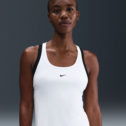 Woman wearing a white tank top with a black Nike logo on a gray background