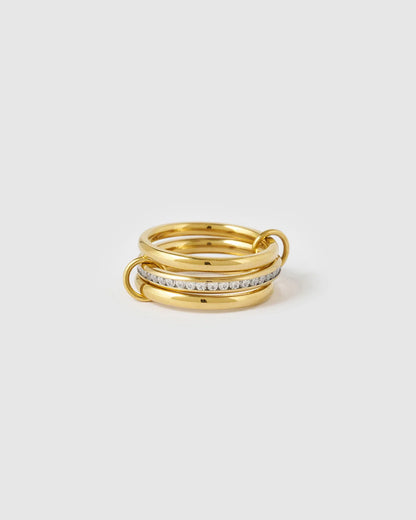 More ring stacking styles in one, the enchanting Indigo Ring combines classic golden bands with sparkling zircon stones for an effortlessly put-together look. Designed to create the illusion of a perfectly curated ring stack, 