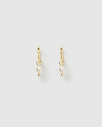 With a delicate pearl drop suspended from a classic gold huggie, Cordelia are easy to stack and style to reflect your unique look.