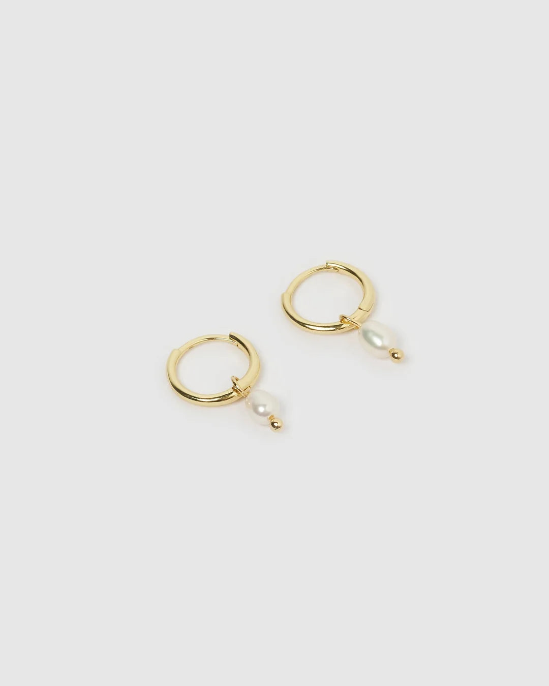 With a delicate pearl drop suspended from a classic gold huggie, Cordelia are easy to stack and style to reflect your unique look.