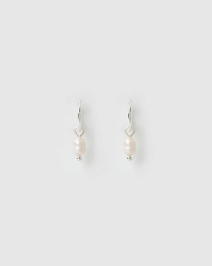 With a delicate pearl drop suspended from a classic silver huggie, Cordelia are easy to stack and style to reflect your unique look.