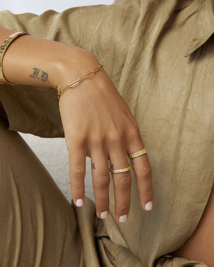 The Small Eros Textured Ring is a true beauty, both to wear and to style. With its shimmering textured surface and sleek design, it's the perfect piece to elevate your ring stack.