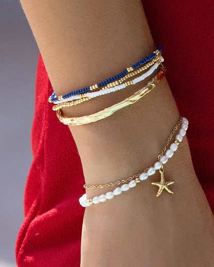 Featuring an array of freshwater pearls and a stunning starfish charm, this bracelet is the classy but cute addition your stack needs