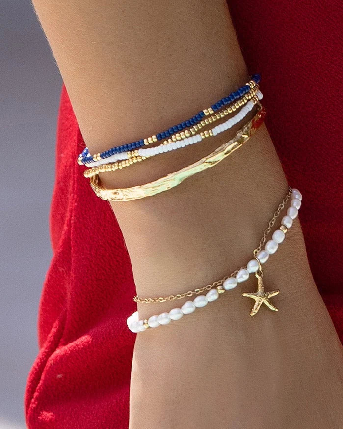 Featuring an array of freshwater pearls and a stunning starfish charm, this bracelet is the classy but cute addition your stack needs