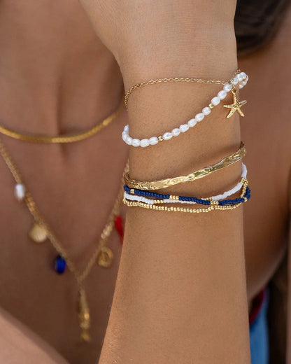 Featuring an array of freshwater pearls and a stunning starfish charm, this bracelet is the classy but cute addition your stack needs