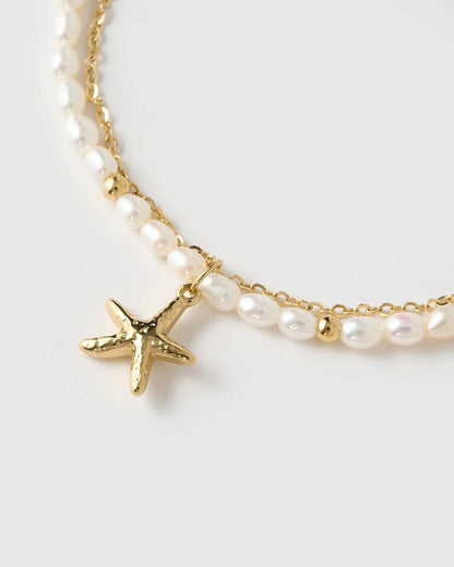 Featuring an array of freshwater pearls and a stunning starfish charm, this bracelet is the classy but cute addition your stack needs