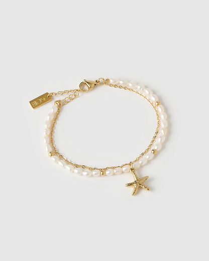 Featuring an array of freshwater pearls and a stunning starfish charm, this bracelet is the classy but cute addition your stack needs