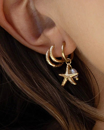 These cute starfish charms are elevated with gorgeous freshwater pearls, for a look that will take you from beach to bar.