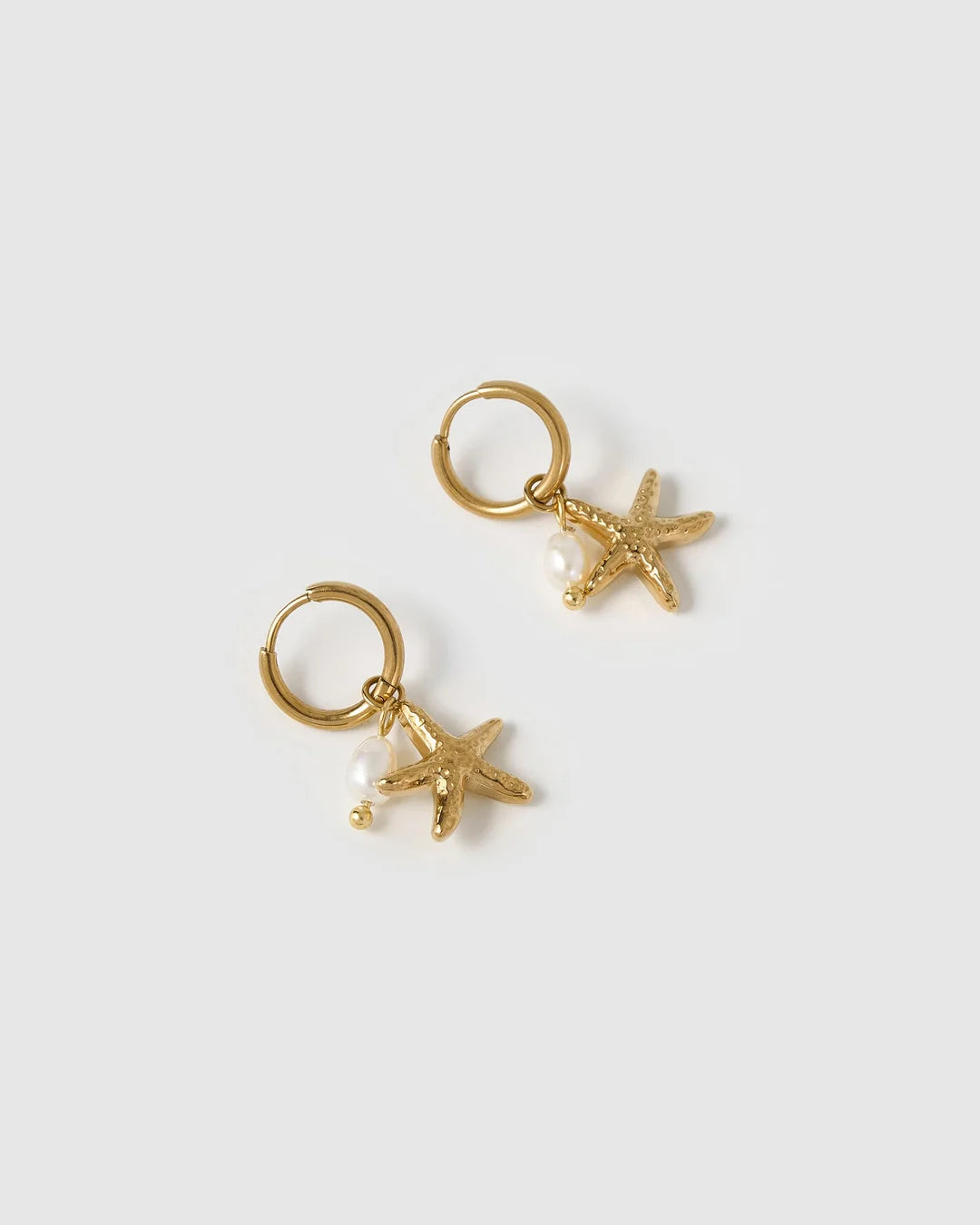 These cute starfish charms are elevated with gorgeous freshwater pearls, for a look that will take you from beach to bar.