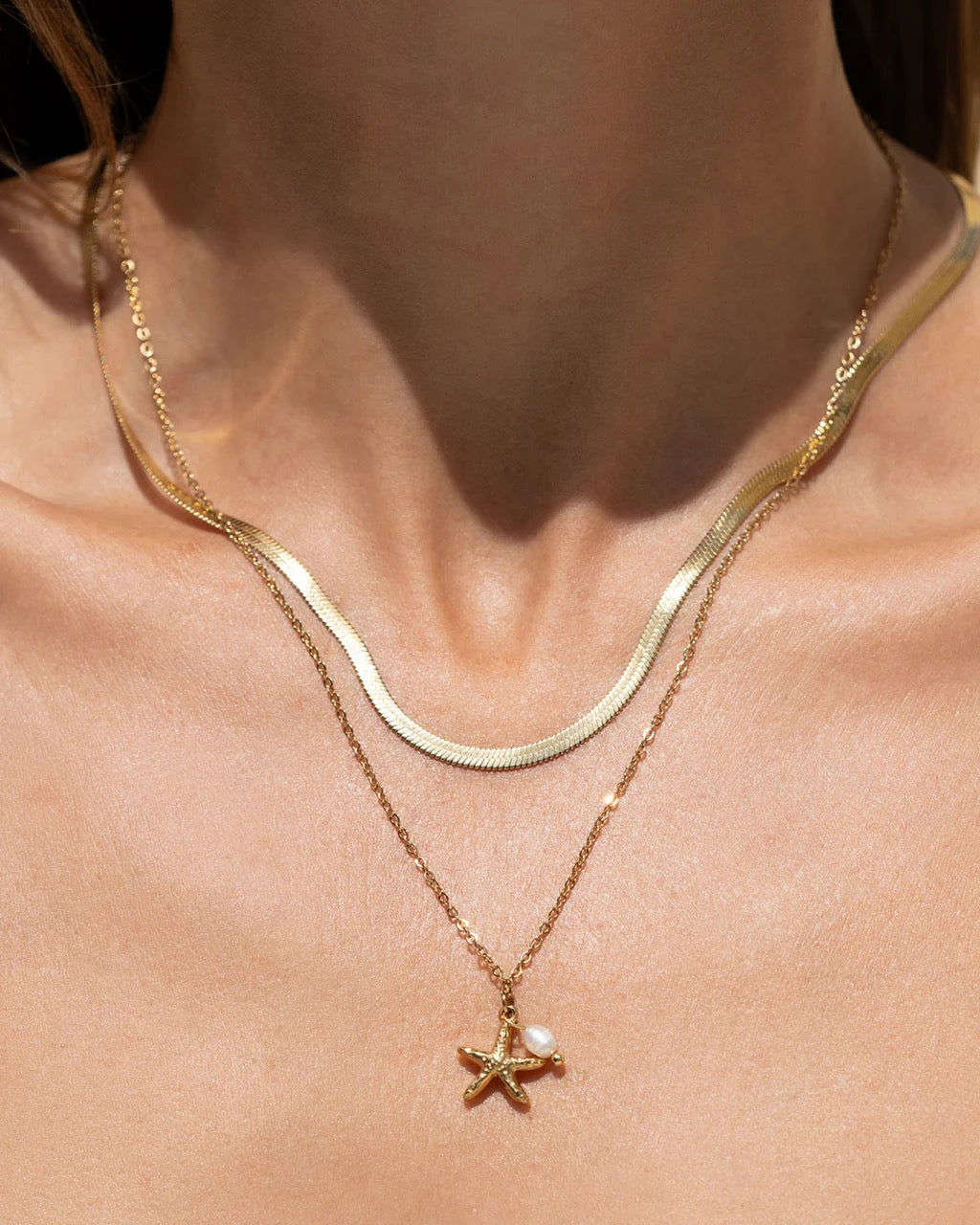 the gorgeous Laguna Necklace, with a cute starfish charm complimented by a stunning freshwater pearl. This pendant is perfect for layering with your favourite staple chain necklaces to create the perfect stack