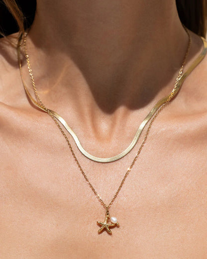 the gorgeous Laguna Necklace, with a cute starfish charm complimented by a stunning freshwater pearl. This pendant is perfect for layering with your favourite staple chain necklaces to create the perfect stack