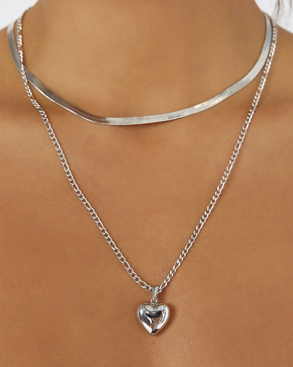 the Rose Necklace is love at first layer. Featuring a classic heart-shaped pendant with a modern, bubbly twist, it's the perfect piece for stacking or making a sweet statement on its own.