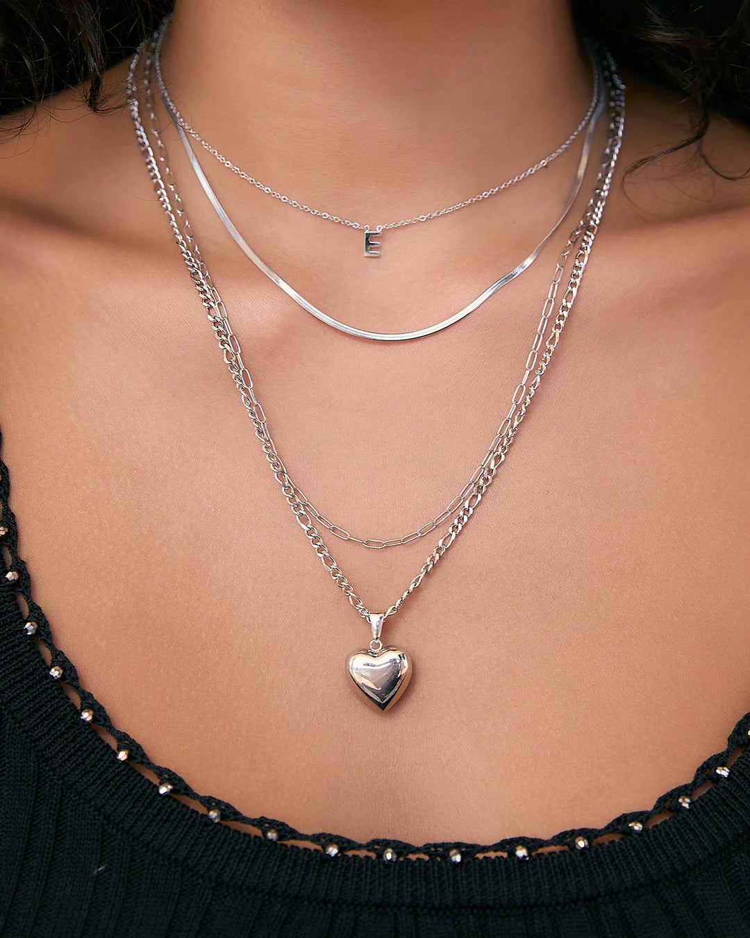 the Rose Necklace is love at first layer. Featuring a classic heart-shaped pendant with a modern, bubbly twist, it's the perfect piece for stacking or making a sweet statement on its own.
