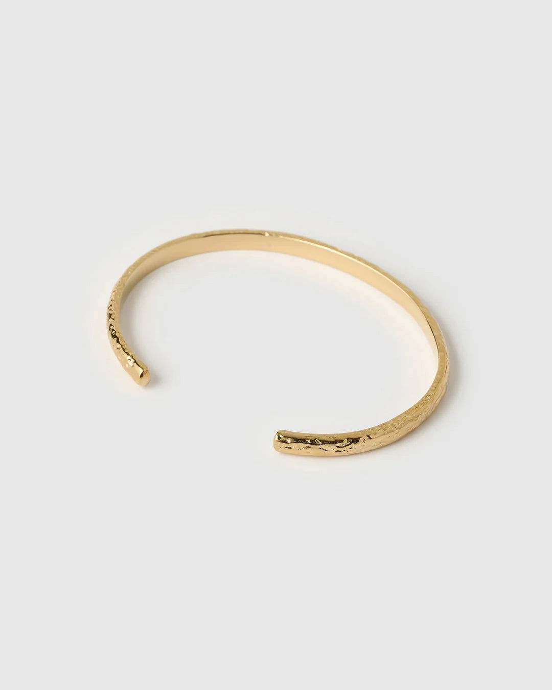 showcasing a stunning crushed gold texture, the Stevie Cuff is designed to turn heads. With its delicate silhouette, classic rounded edges, and slightly malleable fit, this dainty yet striking cuff brings effortless elegance to any jewellery collection.
