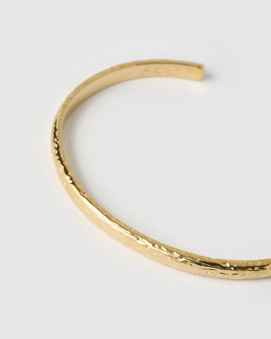 showcasing a stunning crushed gold texture, the Stevie Cuff is designed to turn heads. With its delicate silhouette, classic rounded edges, and slightly malleable fit, this dainty yet striking cuff brings effortless elegance to any jewellery collection.