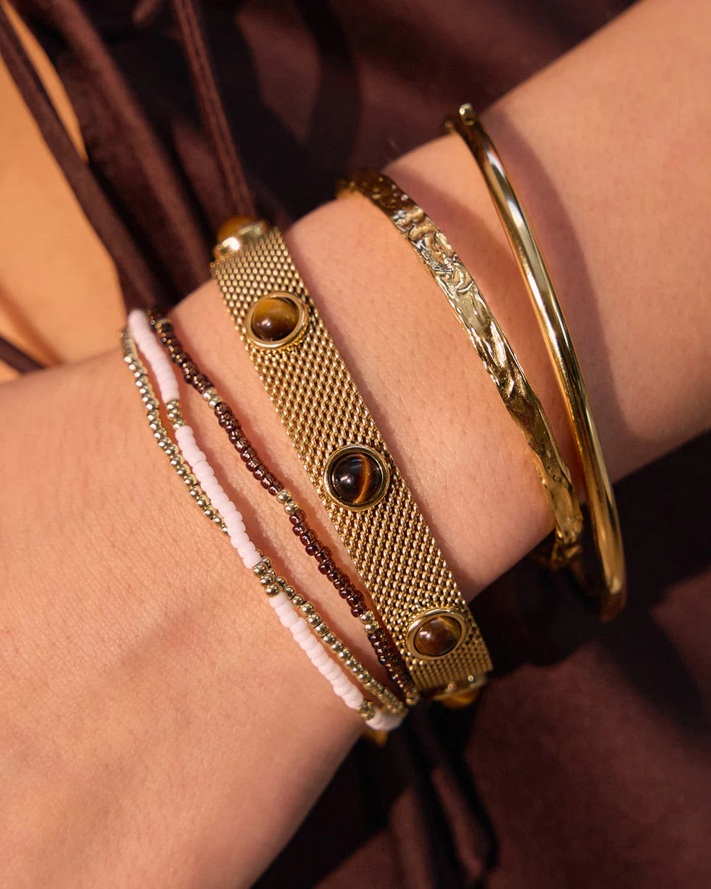  Featuring 3 beaded beauties, one gold, one white and one coffee, this set helps you mix it up and more importantly, make it fun!