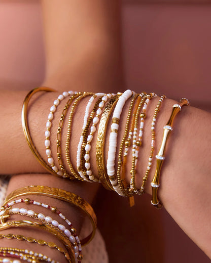  Featuring 3 beaded beauties, one gold, one white and one coffee, this set helps you mix it up and more importantly, make it fun!
