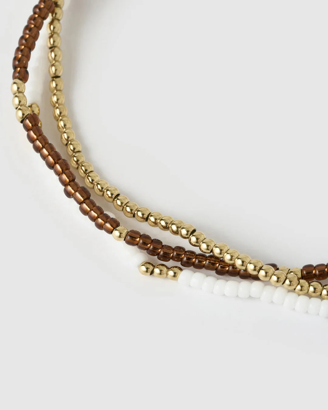  Featuring 3 beaded beauties, one gold, one white and one coffee, this set helps you mix it up and more importantly, make it fun!
