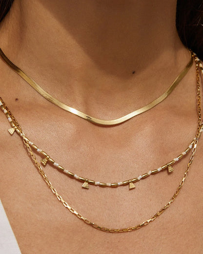 Sophisticated snake chain stacking made simple with the Sylvia Necklace. Complimenting any and every look, Sylvia is a staple in anyone's wardrobe