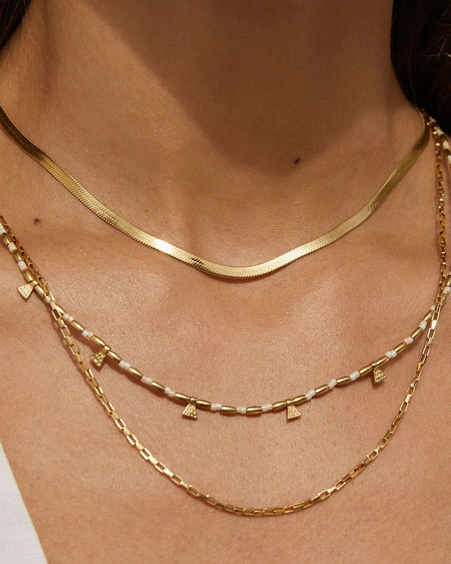 Sophisticated snake chain stacking made simple with the Sylvia Necklace. Complimenting any and every look, Sylvia is a staple in anyone's wardrobe