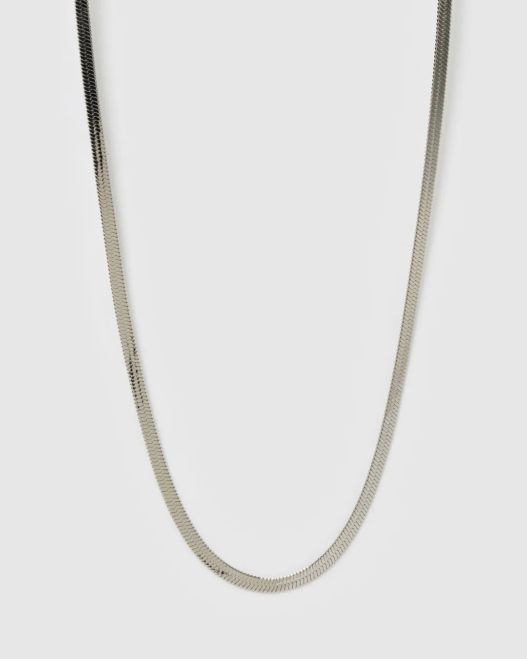 Silver chain necklace on a light gray background