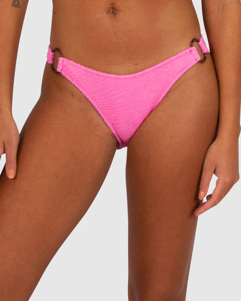 Baku's Ibiza's Ring Side Hipster Bikini Bottom features a flattering dipped waist with copper rind detailing at the side hip. It has a regular coverage bottom. The exciting new solid Ibiza, is a vibrant, dynamic and tactile textural fabrication from Italy.