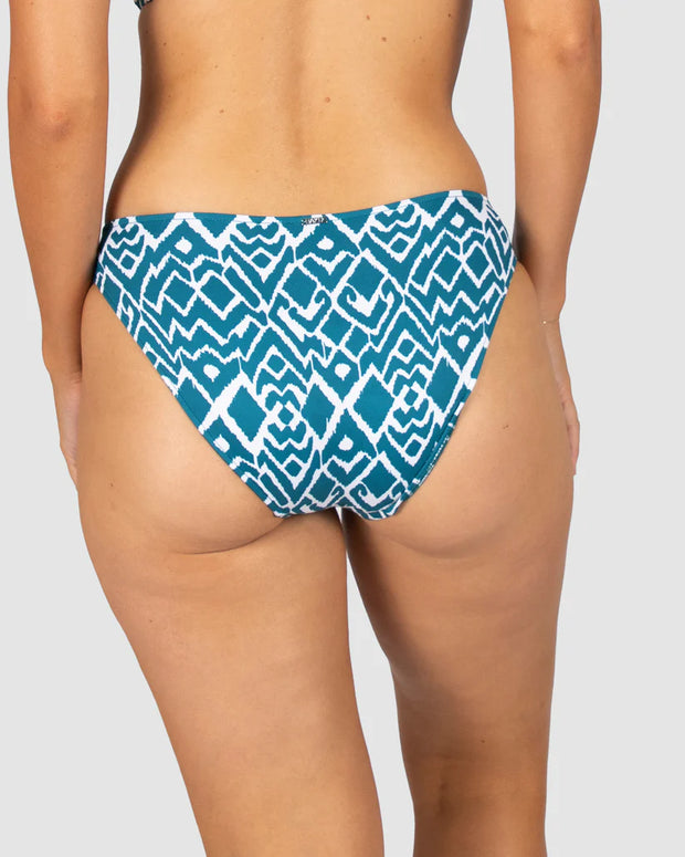 La Selva, is our captivating Ikat print that blends traditional craftsmanship with modern flair. This geometric design features intricate patterns, masterfully woven into shapes that evoke the untamed beauty of the jungle, making La Selva the perfect choice for swimwear that stands out with timeless elegance and a touch of adventurous spirit. Dive into style with La Selva, where tradition meets trend.