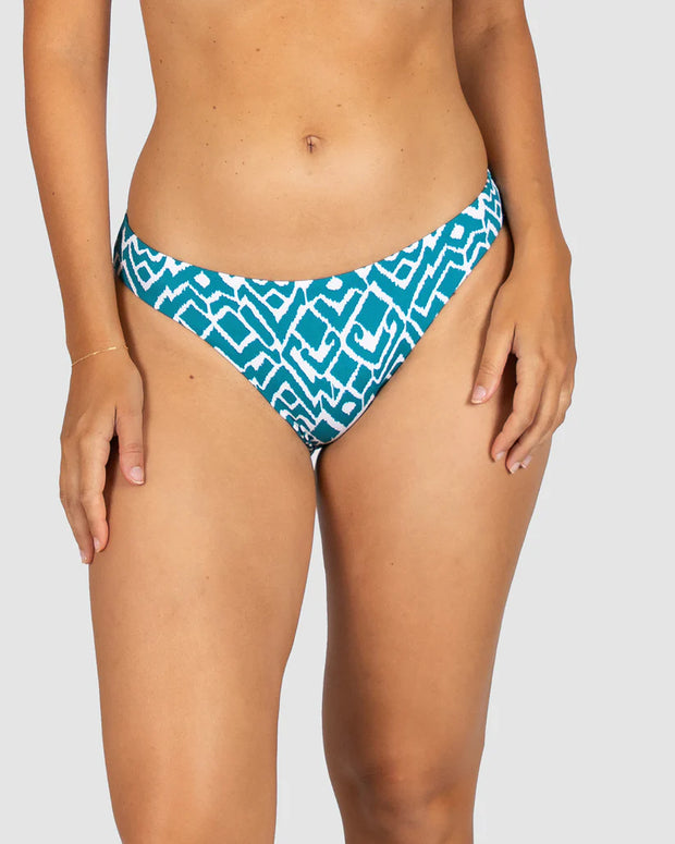 La Selva, is our captivating Ikat print that blends traditional craftsmanship with modern flair. This geometric design features intricate patterns, masterfully woven into shapes that evoke the untamed beauty of the jungle, making La Selva the perfect choice for swimwear that stands out with timeless elegance and a touch of adventurous spirit. Dive into style with La Selva, where tradition meets trend.