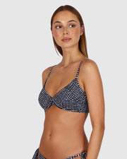 Introducing the Marilyn Twist Bralette, a versatile swimwear essential crafted with thoughtful details for a customizable and stylish beach look. This bralette features removable soft cups and a flattering twist design, complemented by adjustable and convertible straps, all secured with a convenient clip back closure for both comfort and convenience.