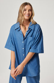 Relaxed fit, button front shirt  Elbow length sleeve  Left chest pocket  Functional buttons through the front  Slight curved hemline  100% cotton chambray fabric  Chantel wears a size small and is 173cm tall
