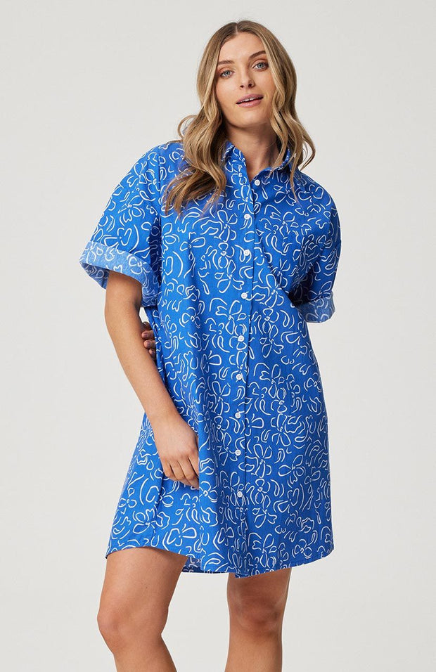 Relaxed fit, button front shirt dress Elbow length sleeve  Left chest pocket Functional buttons through the front Slight curved hemline with longer back Cartel& Willow exclusive had drawn 'Cobalt Floral' print 100% cotton linen fabric Chantel wears a size small and is 173cm tall Balance 2023 collection