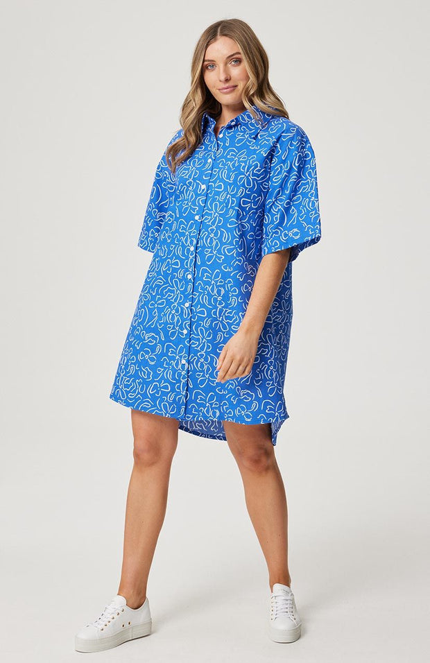 Relaxed fit, button front shirt dress Elbow length sleeve  Left chest pocket Functional buttons through the front Slight curved hemline with longer back Cartel& Willow exclusive had drawn 'Cobalt Floral' print 100% cotton linen fabric Chantel wears a size small and is 173cm tall Balance 2023 collection