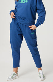 Drop-crotch track pants  Elasticated waistband  Contrast white drawstring  Side inseam pockets  Small C&W logo in jade print under the left pocket  100% cotton terry fabric  Chantelle wears a size small and is 173cm tall