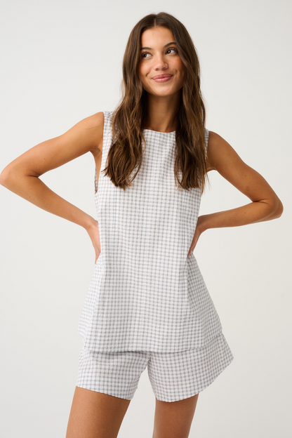High neck tank
Center back exposed metal zip
Princess line panels with topstitching
Hip length hemline