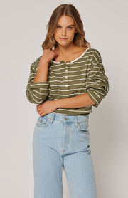 Long sleeve, relaxed fit t-shirt Rounded, scoop neckline with henley style button placket Contrast white neck binding 100% cotton slub jersey fabric  Ebony wears a size small and is 168cm tall Raine 2024 collection