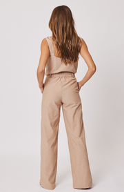 Straight leg, high waisted trouser  Front zipper with fly and button closure  Elastic through the back waistband  Belt loops along the waistband  Side inseam pockets at the hip  100% cotton chambray fabric