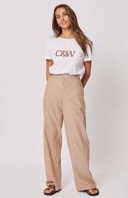 Straight leg, high waisted trouser  Front zipper with fly and button closure  Elastic through the back waistband  Belt loops along the waistband  Side inseam pockets at the hip  100% cotton chambray fabric