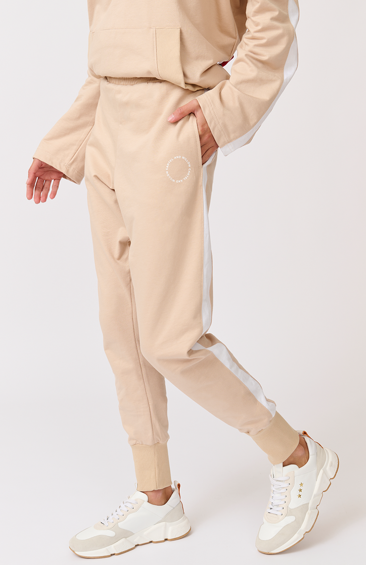 Relaxed fit, comfy, jogger style pant Elasticated waistband Scoop front pockets White stripe down the side leg Wide width ribbed ankle cuffs 1000% cotton terry fabric Nikki wears a size small and is 173cm tall