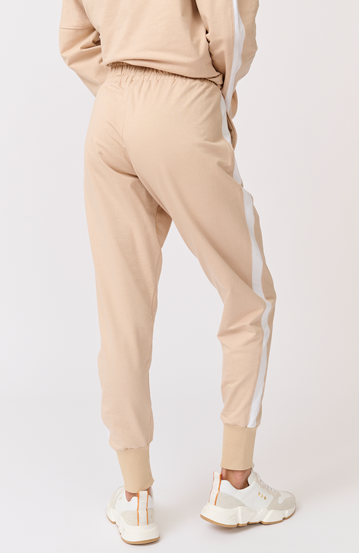 Relaxed fit, comfy, jogger style pant Elasticated waistband Scoop front pockets White stripe down the side leg Wide width ribbed ankle cuffs 1000% cotton terry fabric Nikki wears a size small and is 173cm tall