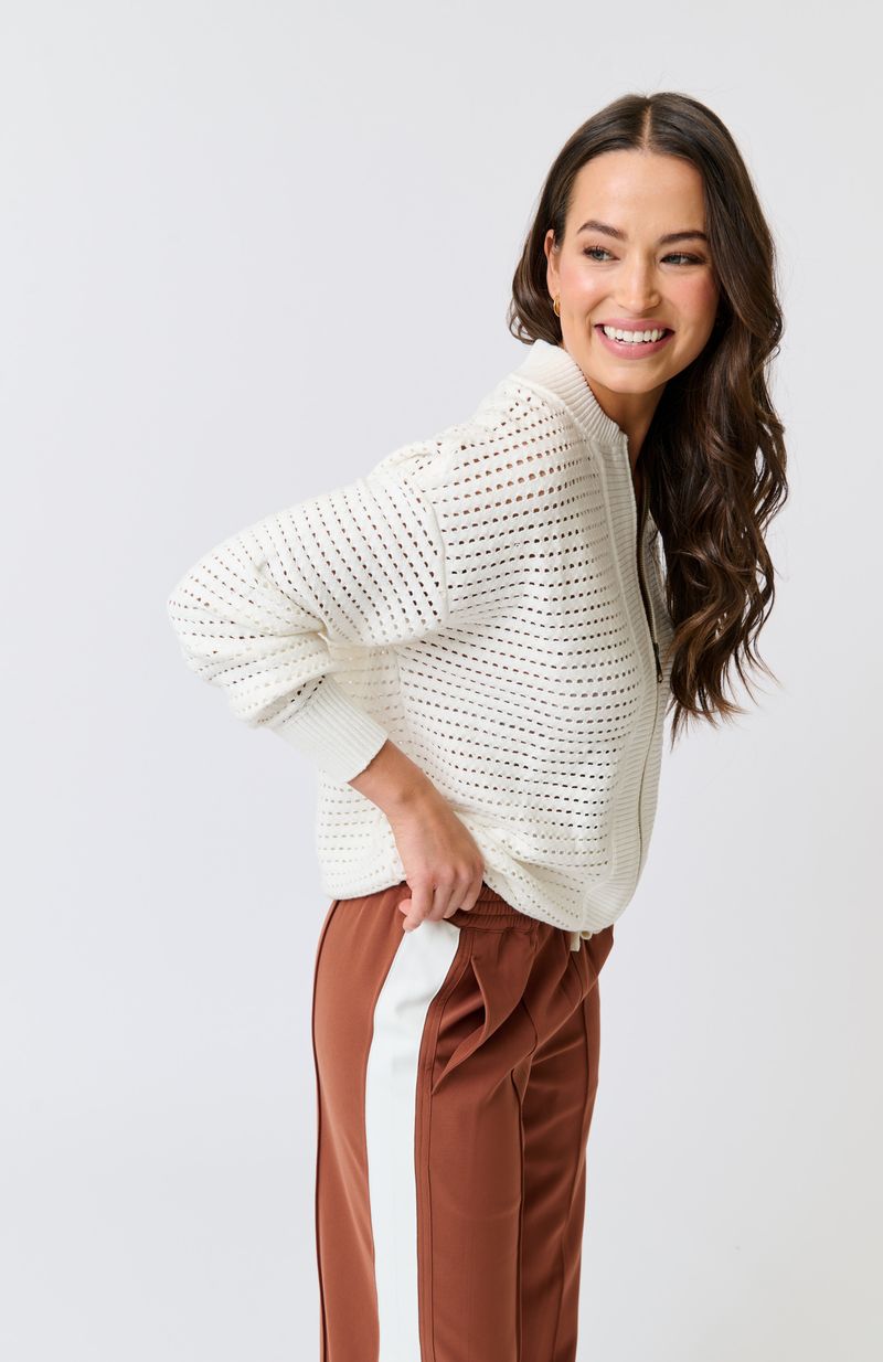 Knit bomber style zip through jacket
Open pointelle knit pattern
Ribbed neck, hemline, sleeve cuffs and zipper placket
Dropped shoulder with long sleeves
Designed to be turned up at the hem for a relaxed look
75% viscose, 25% polyester knit fabric
