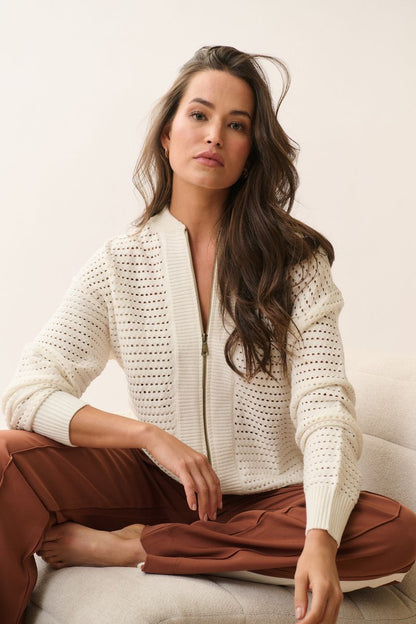 Knit bomber style zip through jacket
Open pointelle knit pattern
Ribbed neck, hemline, sleeve cuffs and zipper placket
Dropped shoulder with long sleeves
Designed to be turned up at the hem for a relaxed look
75% viscose, 25% polyester knit fabric