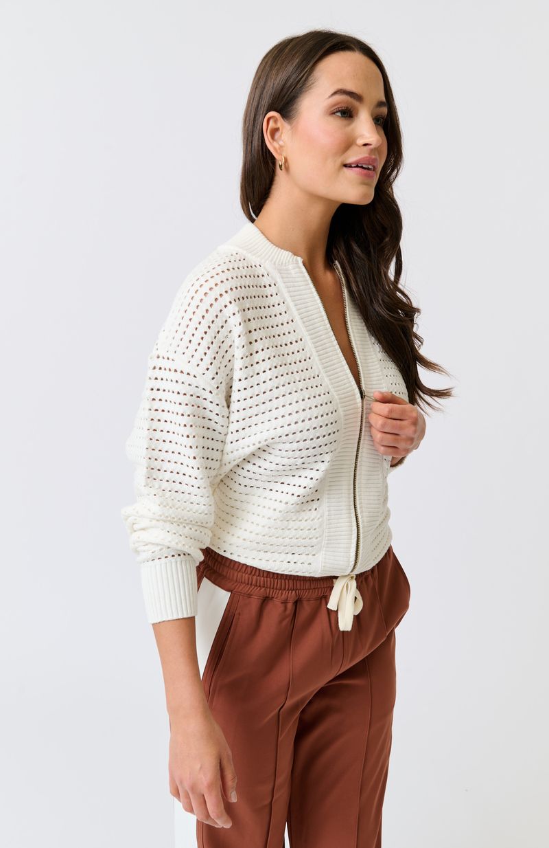 Knit bomber style zip through jacket
Open pointelle knit pattern
Ribbed neck, hemline, sleeve cuffs and zipper placket
Dropped shoulder with long sleeves
Designed to be turned up at the hem for a relaxed look
75% viscose, 25% polyester knit fabric