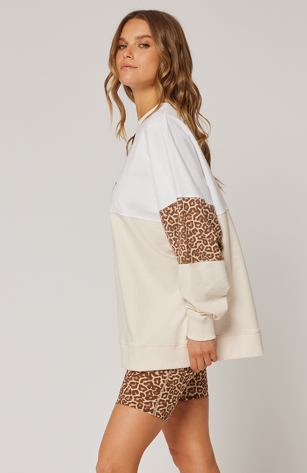 Hip length, relaxed fit sweater Dropped shoulder gives an effortless look Ribbed neckline, sleeve cuffs and waistband Panelled seams of white, hazel leopard and vanilla Large C&W logo in khaki print on the front chest 100% cotton terry fabric Ebony wears a size medium for an oversized fit and is 168cm tall Raine 2024 collection