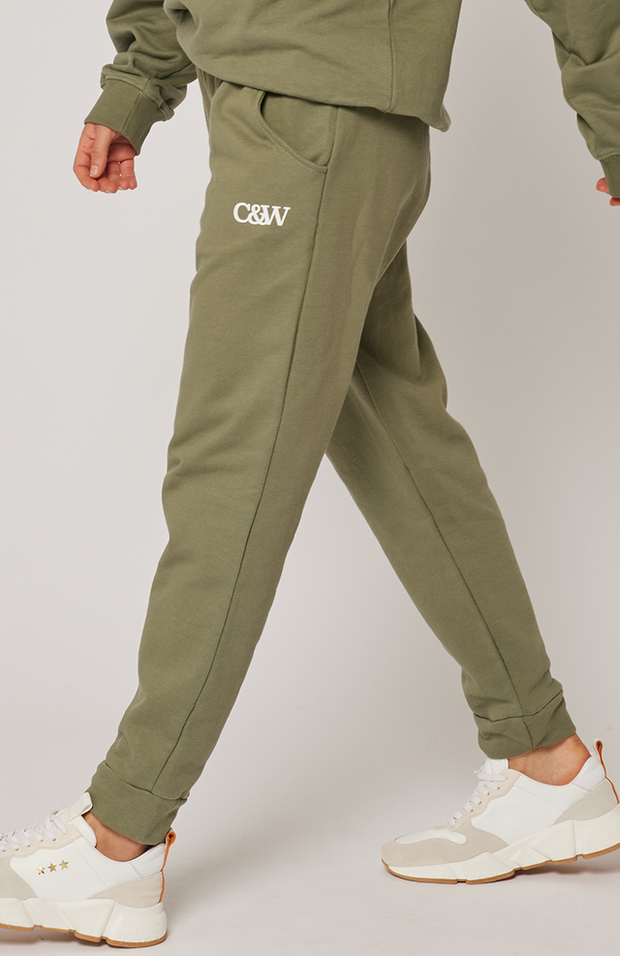 Relaxed fit, comfy, jogger style pant Draw cord waistband Scoop front pockets Cuffed ankle band Small C&W logo in white print under the left pocket 100% cotton terry fabric Ebony wears a size small and is 168cm tall Raine 2024 collection