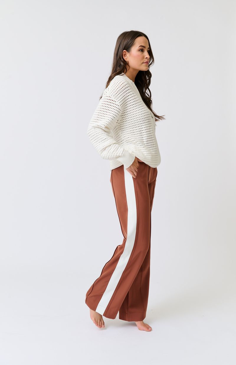 Elasticated waistband with functional drawstring
Straight leg fit
Inseam side pockets
Front and back leg pin tuck seam detailing
Contrast off white stripe grosgrain tape along outer leg 
98% Polyester, 2% spandex fabric