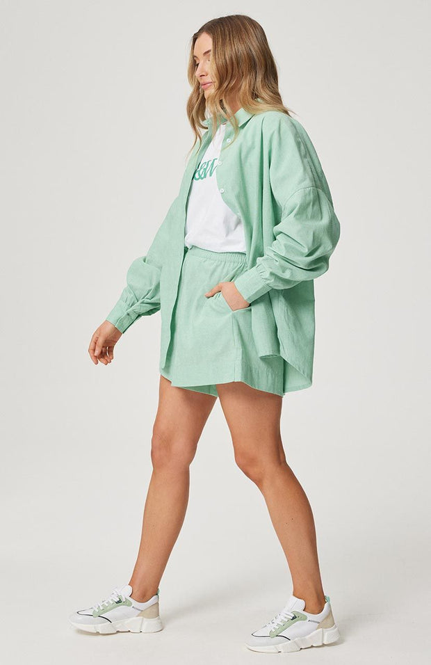 Oversized fit, button front shirt Longline, curved hemline Full length sleeve with button cuff 100% cotton chambray fabric in yarn dyed Jade Chantelle wears a size small and is 173cm tall Balance 2023 collection