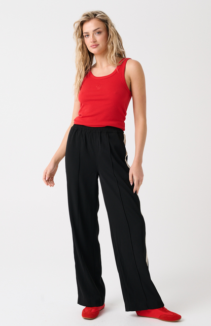 Elasticated waistband
Straight leg fit
Inseam side pockets
Front and back leg pin tuck seam detailing
Lurex stripe tape detailing along outer leg