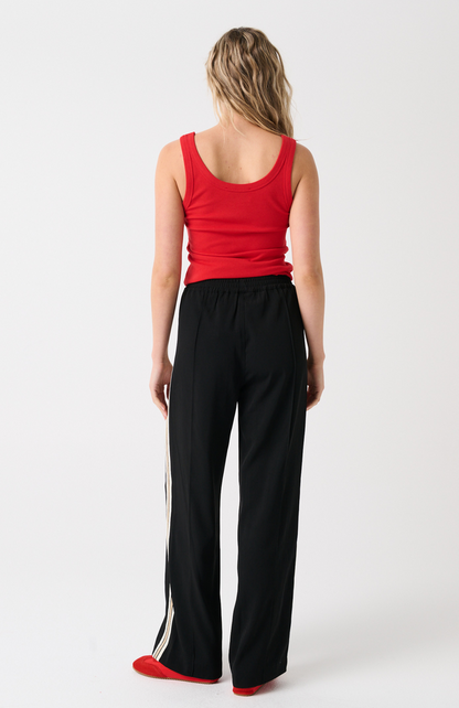 Elasticated waistband
Straight leg fit
Inseam side pockets
Front and back leg pin tuck seam detailing
Lurex stripe tape detailing along outer leg