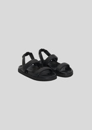 Simplistic leather sling back sandal on a soft footbed  Leather upper  Padded straps with an elastic gusset on back  1.5cm moulded sole with footbed leather lining